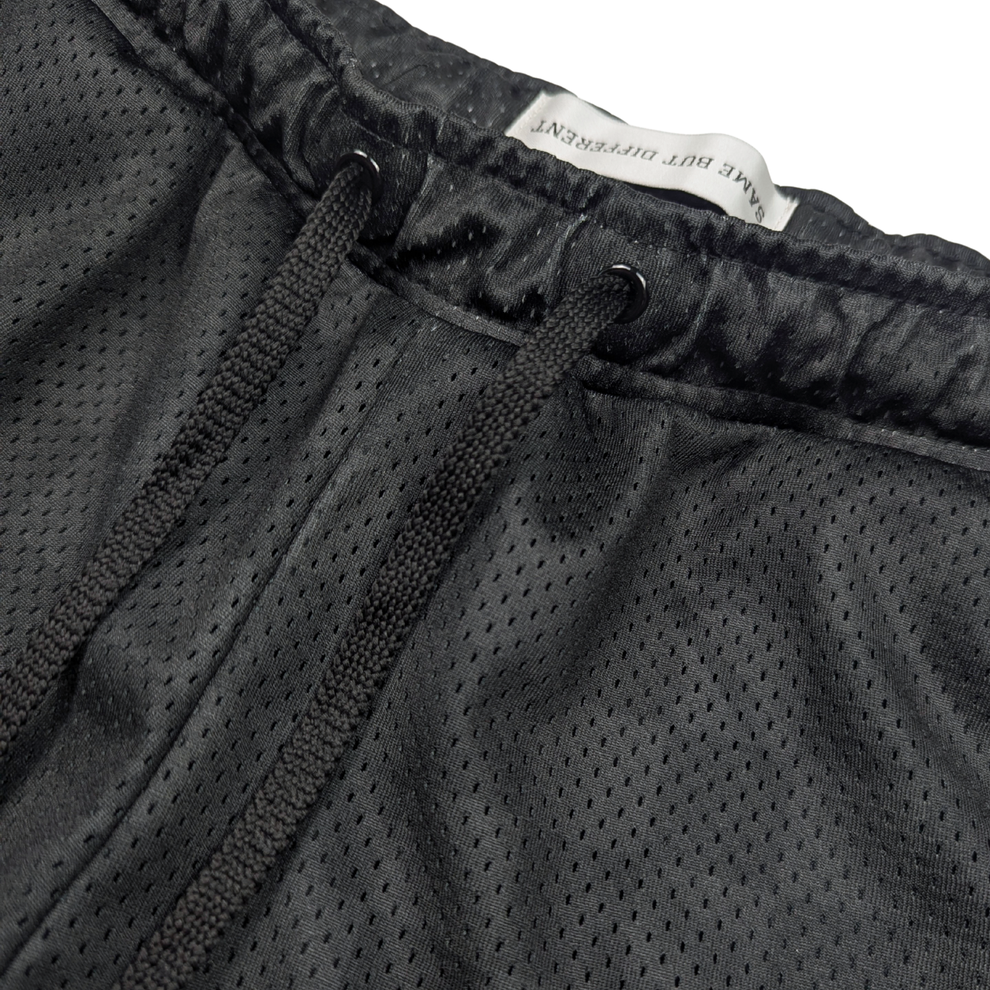 Close-Up of women's mesh basketball shorts with inner lining